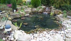 A Heron Guard Fitted To A Pond With A Soft Surround